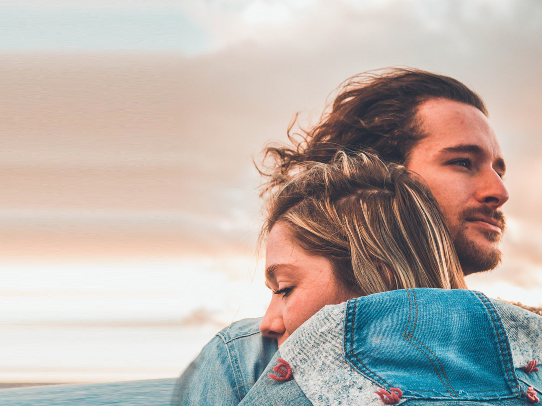 man-holding-women-sky-background-tablet